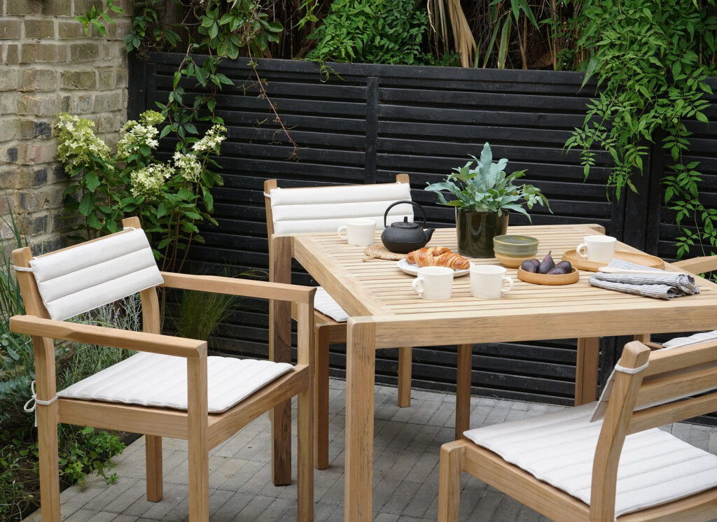 [Ad] A green urban oasis with Carl Hansen & Son wooden outdoor furniture